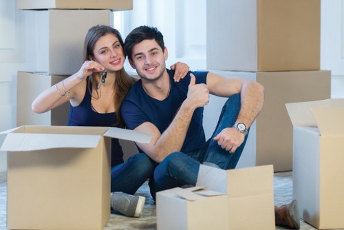 Furniture removals team handling household items in a Wandsworth property