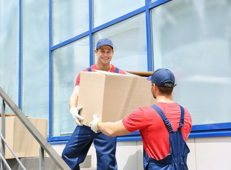 Local movers carrying items from a shared student house in Wandsworth