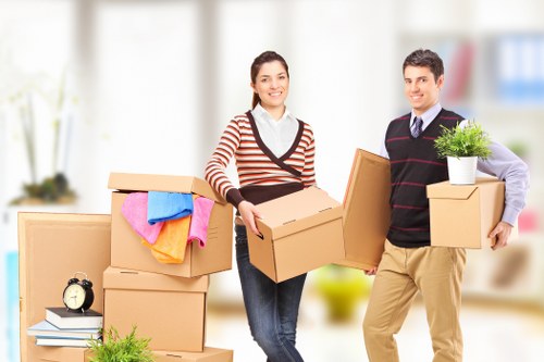 Professional removals crew loading bulky items for a fast Wandsworth move