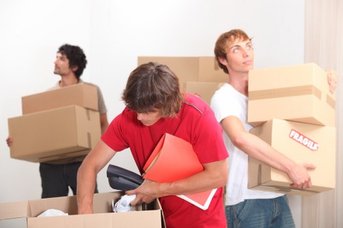 Moving day preparation with labelled boxes and wrapping materials