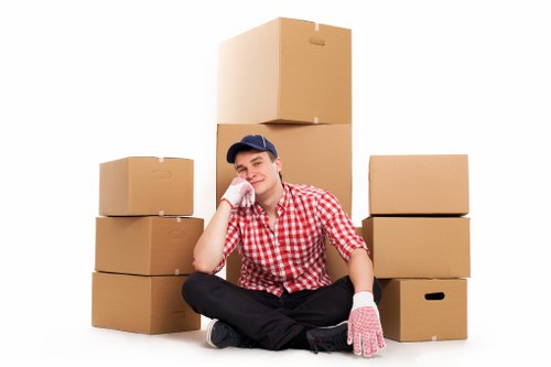 Commercial relocation process with packed office items and labelled boxes